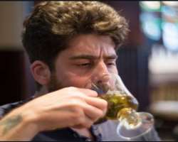 Adam Goldberg consuming alcohol
